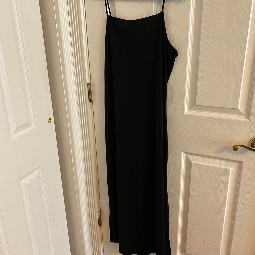Black spaghetti strap dress with side slits.